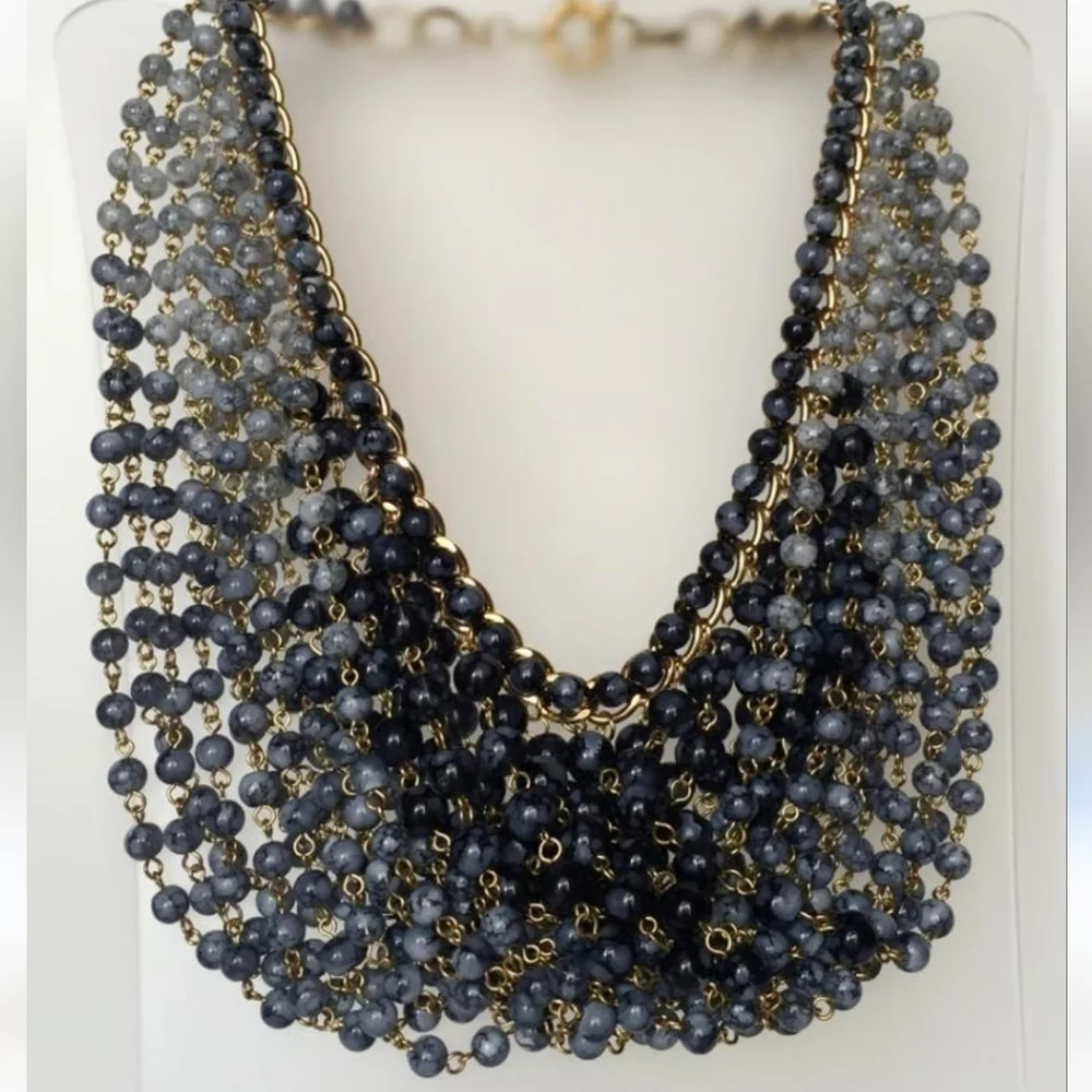 Gold plated cuban link chain with dangling graduated color jasper roundbeads